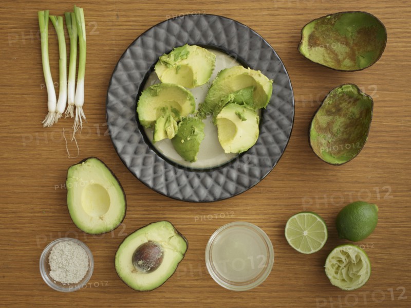 Studio shot of avocado, lime and scallion for guacamole
