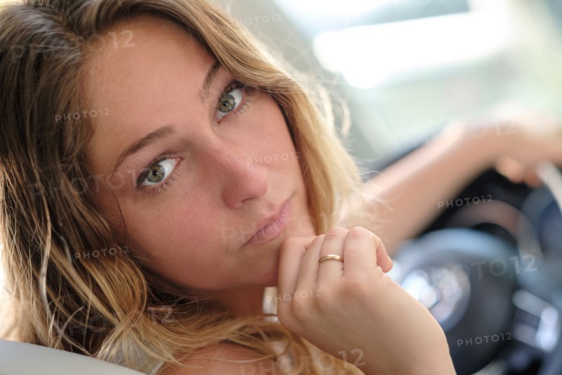 Portrait of woman in car driving