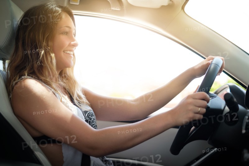 Happy woman driving
