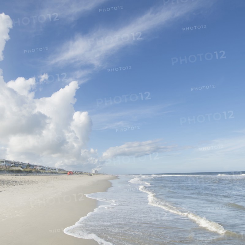 Clouds above beach and sea