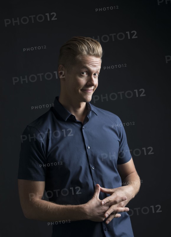 Portrait of man frowning and smiling