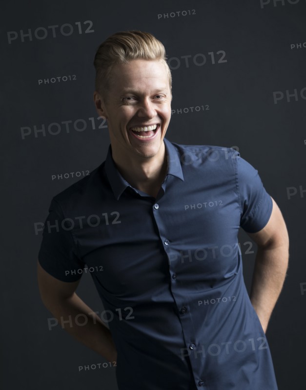 Portrait of blond man laughing