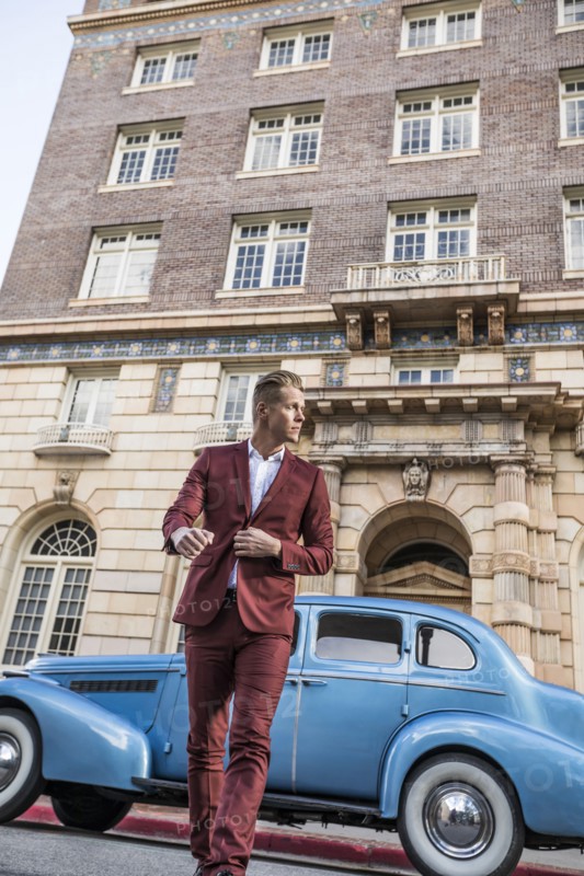 USA, Utah, Salt Lake city, Elegant man crossing street, vintage car in background