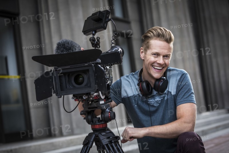Portrait of smiling camera operator