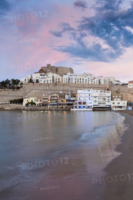 Spain, Valencian Community, Peniscola, Waterfront town at sunset