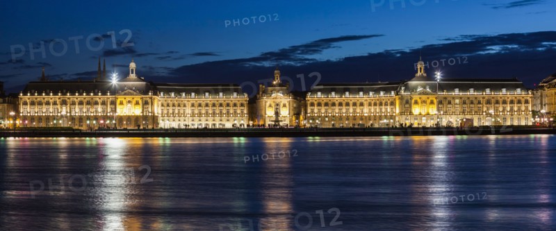 France, Nouvelle-Aquitaine, Bordeaux, Place de la Bourse across Garonne River at night