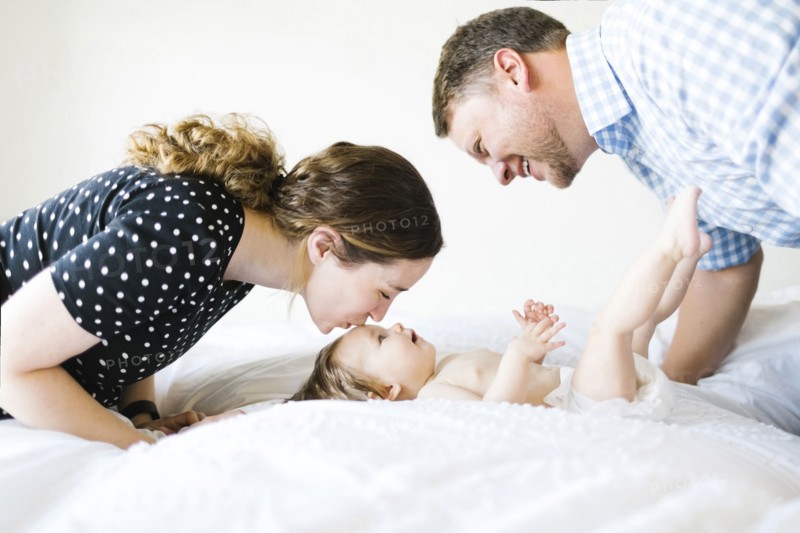 Baby girl (6-11 Months) spending time with parents