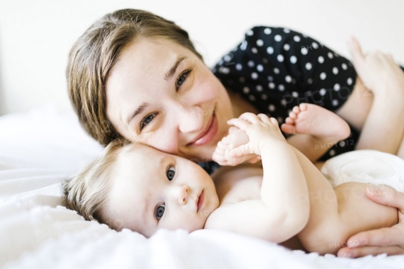 Portrait of baby girl (6-11 Months) with mother