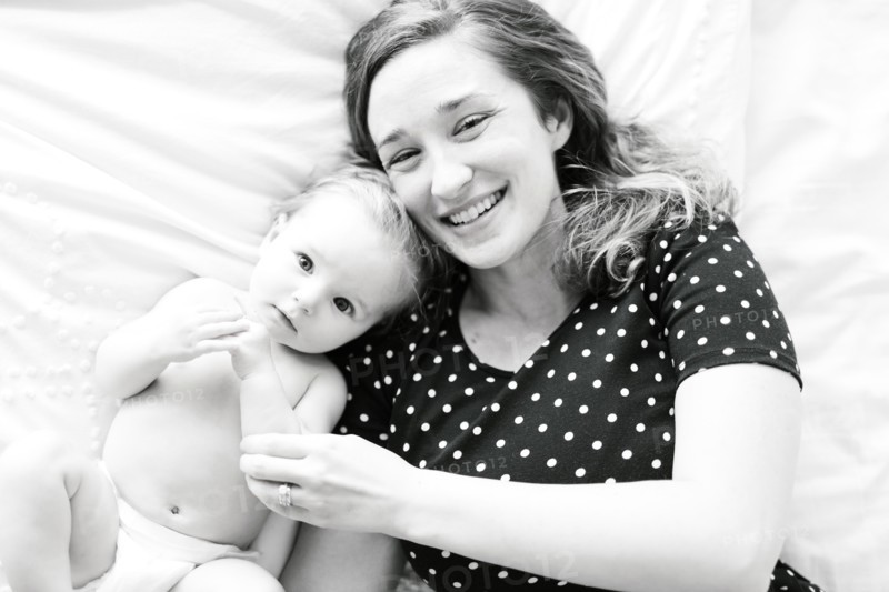 Portrait of baby girl (6-11 Months) with mother, directly above