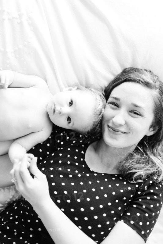 Portrait of baby girl (6-11 Months) with mother, directly above