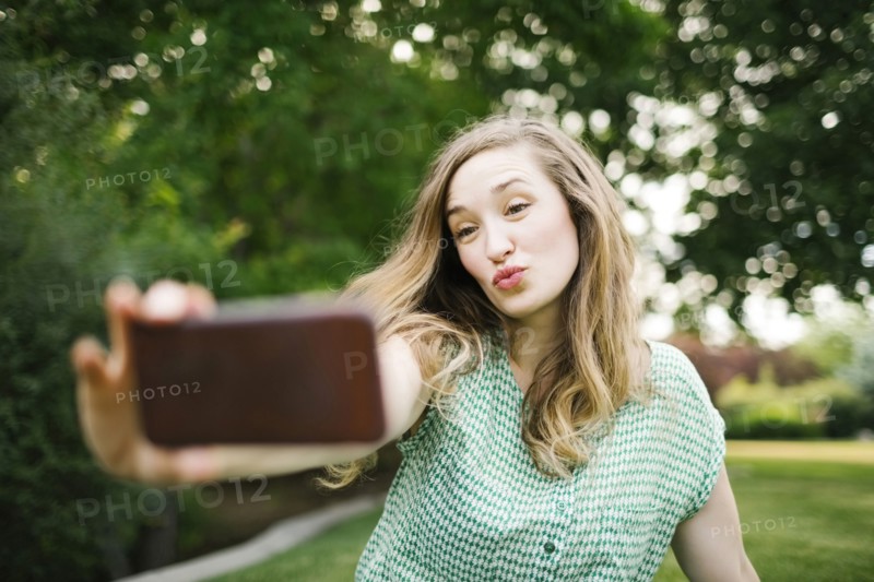 Beautiful woman taking selfie