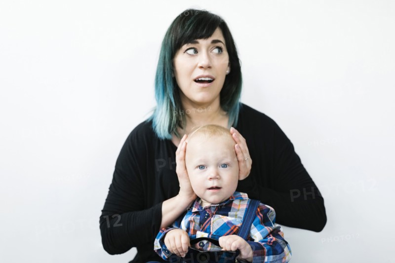 Mother covering son's ears (12-17 months)