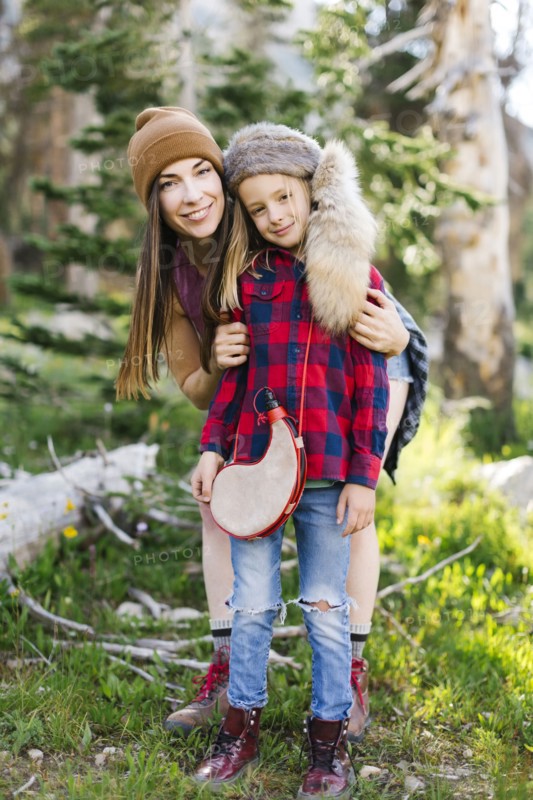 Portrait of mother with son (6-7) hiking in forest
