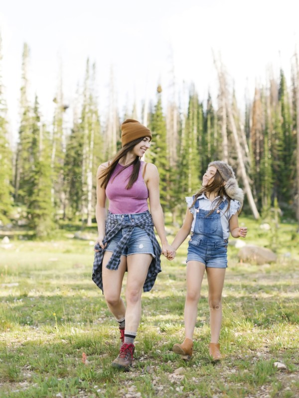Mother with daughter (8-9) hiking in forest