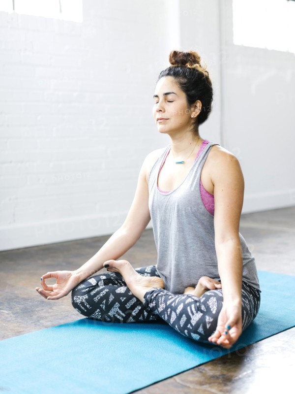 Woman meditating in lotus position