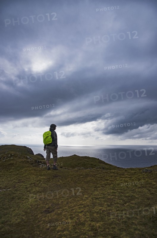 Ireland, County Donegal, Hiker looking at Donegal bay along Wild Atlantic Way