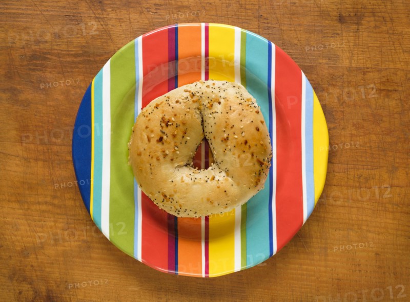 Bagel on colorful plate