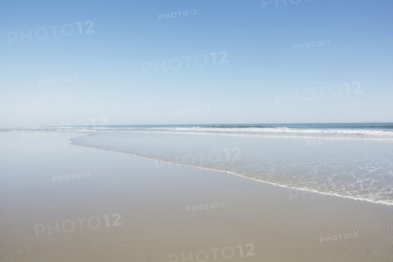 Empty beach on sunny day