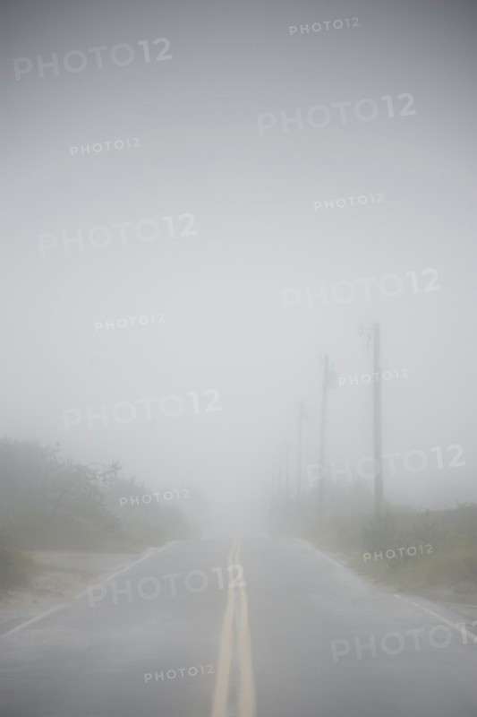 USA, Massachusetts, Nantucket Island, Road in fog