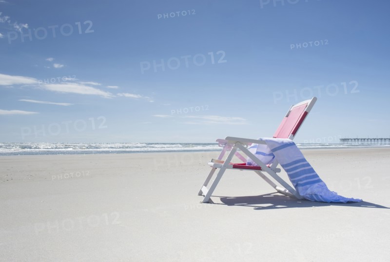 Deckchair on empty beach