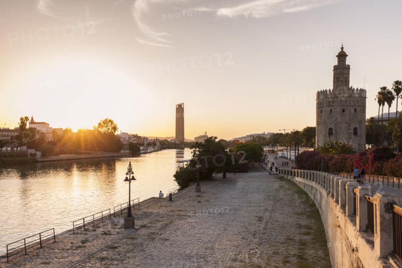 Spain, Andalusia, Seville, Golden Tower against sunrise