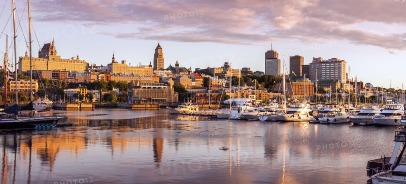 Canada, Quebec, Quebec City, Coastline with marina and buildings reflected in water