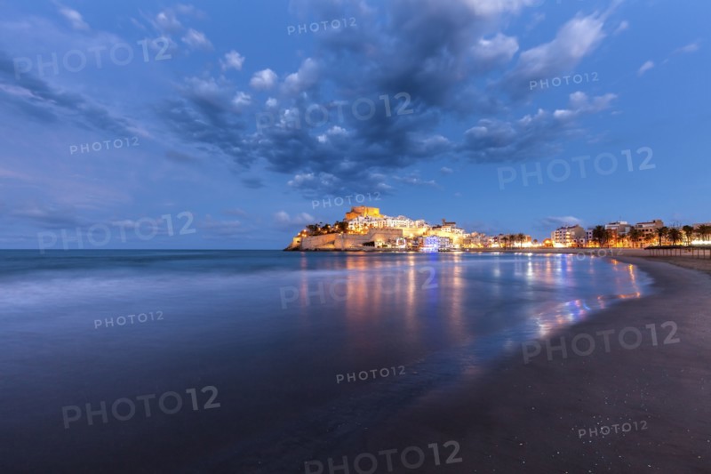 Spain, Valencian Community, Peniscola, Illuminated town by sea