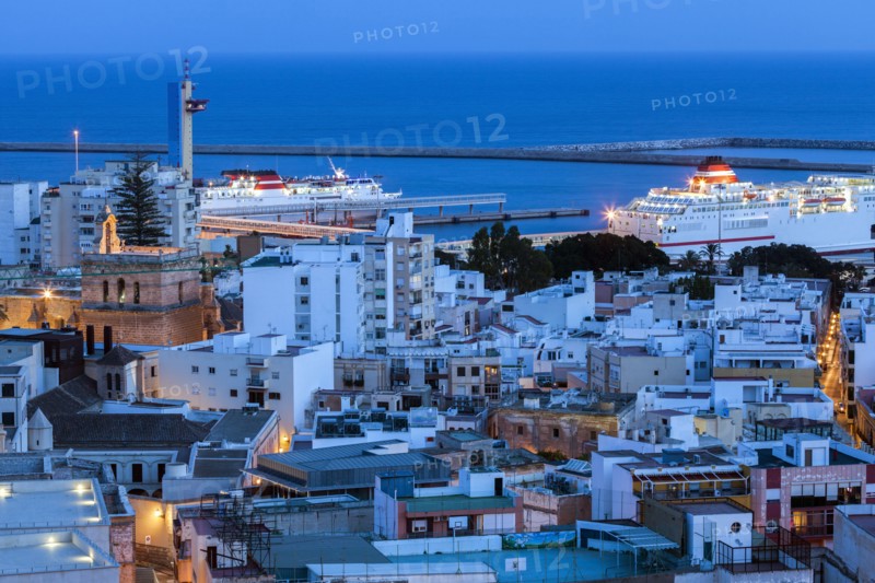 Spain, Andalusia, Almeria, Cityscape with sea at dusk