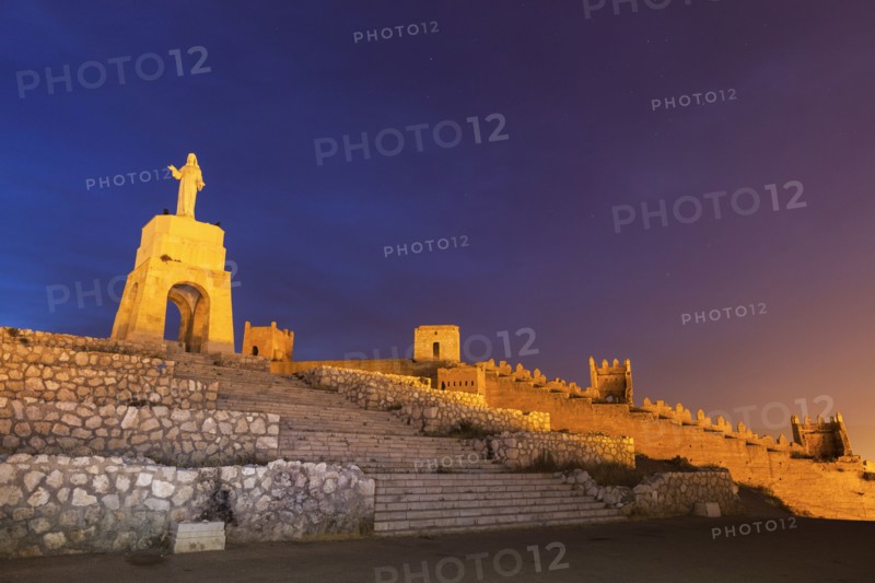 Spain, Andalusia, Almeria, Statue of Sacred Heart of Jesus at dusk