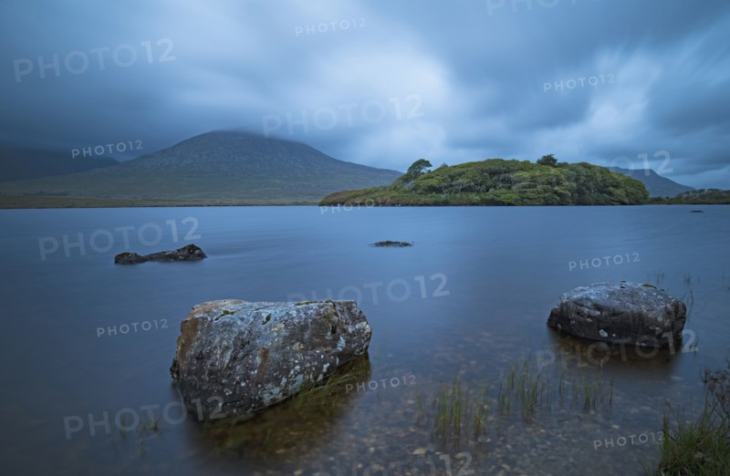 Ireland, Galway County, Connemara, Stones in lake