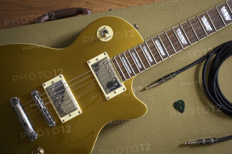 Gibson Les Paul and music equipment lying on guitar case