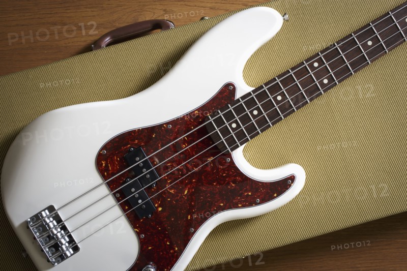 Bass guitar lying on guitar case