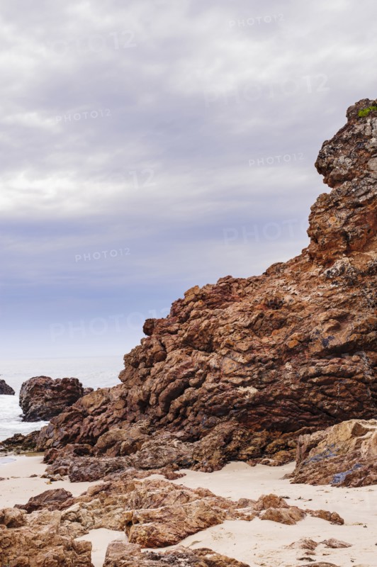 Australia, New South Wales, Rock formation on sandy beach