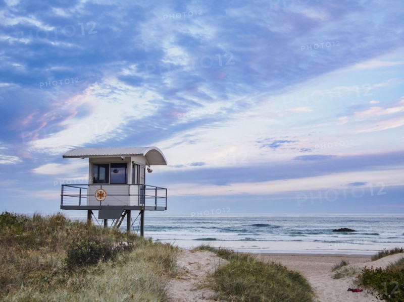 Australia, New South Wales, Lifeguard hut against moody sky