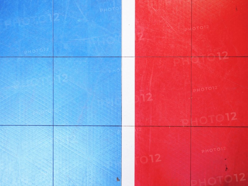Red and blue tiled floor of basketball court