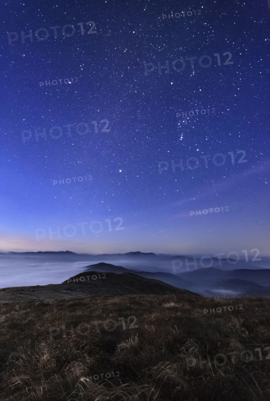 Ukraine, Zakarpattia region, Rakhiv district, Carpathians, Chornohora, Sheshul, Mist over mountain meadow at dawn