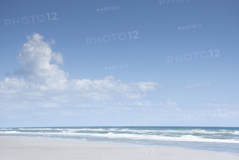 Blue sky and clouds above sea