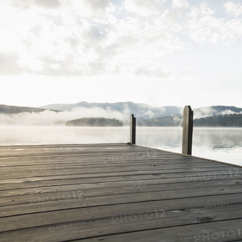 USA, New York, Lake Placid, Pier with foggy lake in background