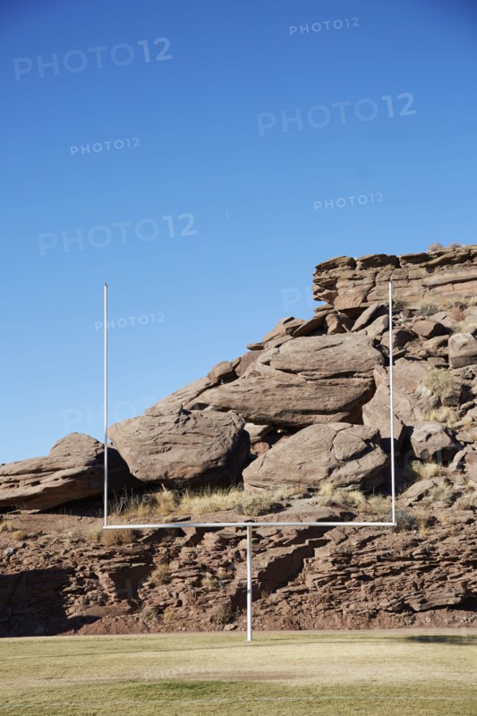 USA, Arizona, American football field goal with rocks in background