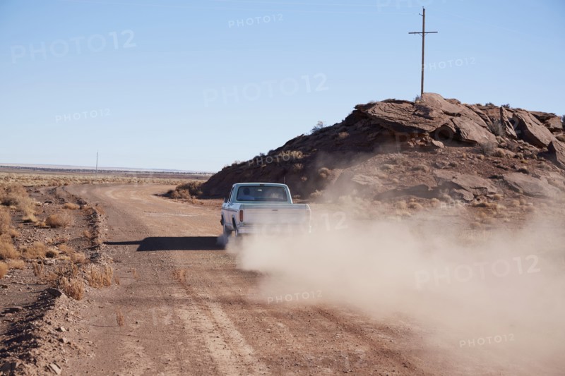 USA, Arizona, Pick up truck on dusty road