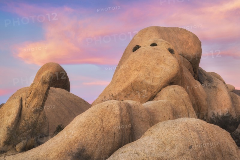 USA, California, Joshua Tree National Park, Rock formations at sunset