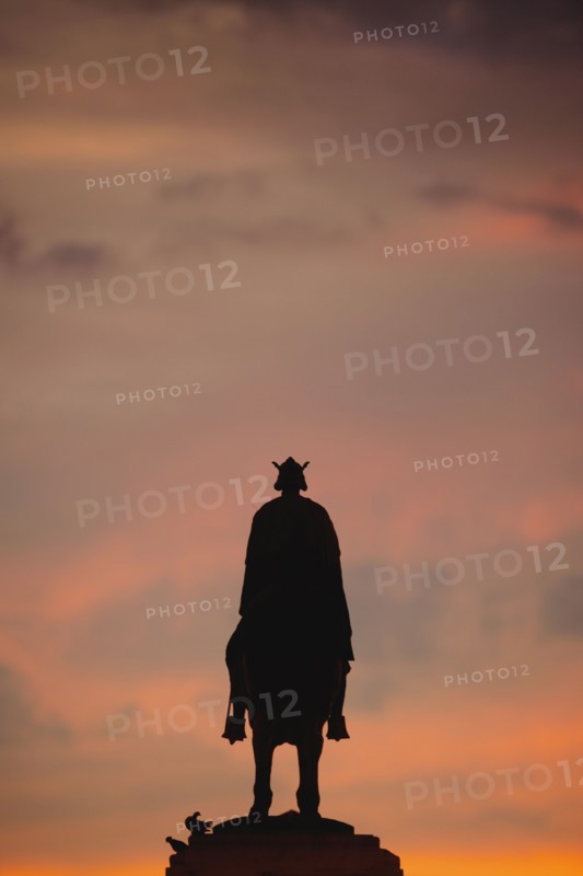 Spain, Seville, Plaza Nueva, Silhouette of equestrian statue of King Fernando III