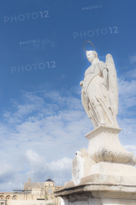Spain, Andalusia, Cordoba, Statue of San Rafael against clouds