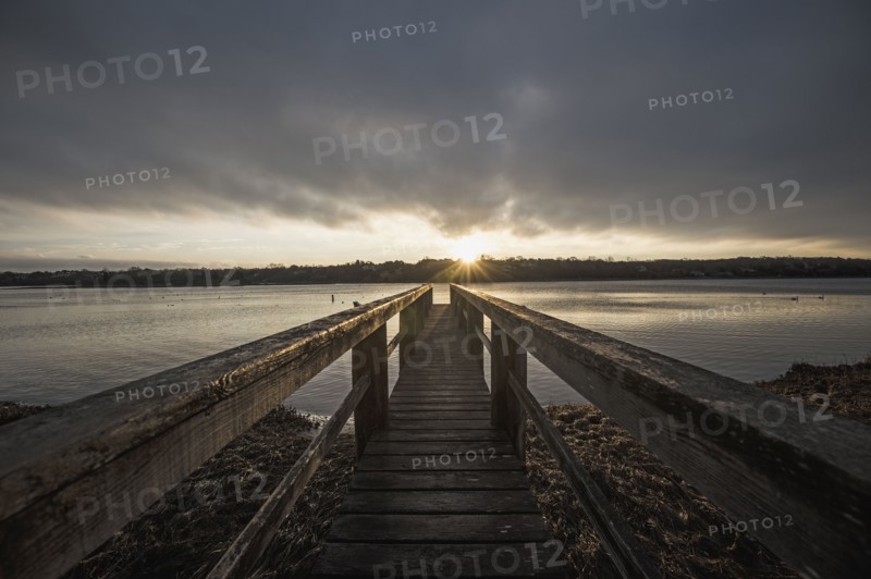 USA, Massachusetts, Eastham, Cape Cod, View from jetty on lake at sunrise