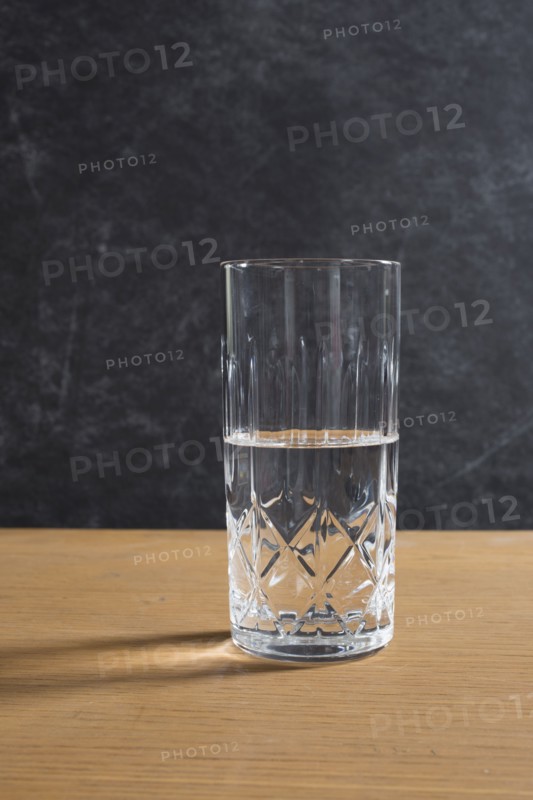 Half full glass on table