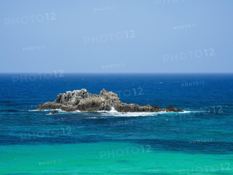 Australia, New South Wales, Bermagui, Wave splashing on rock formation in sea