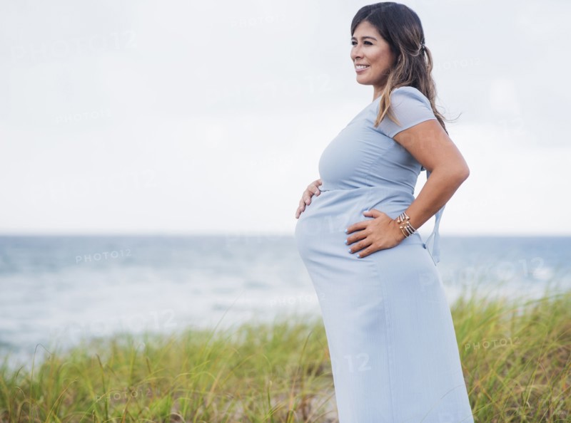 Pregnant woman wearing blue dress