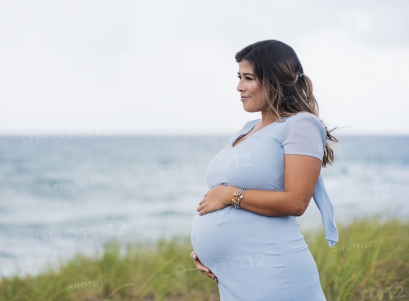 Pregnant woman wearing blue dress