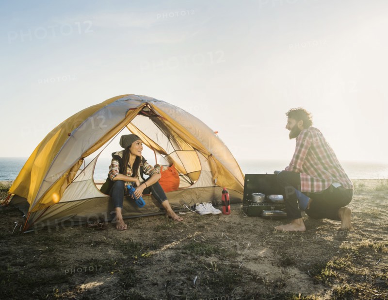 Couple camping on beach