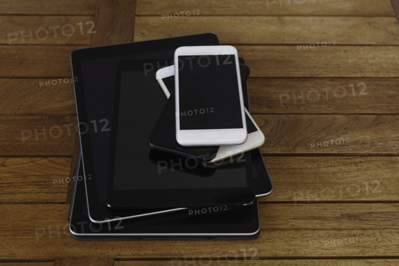 Stack of smart phones and digital tablets